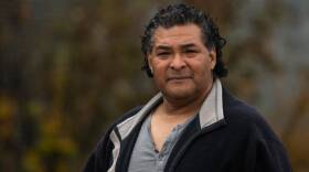 An Alaska Native man in a black jacket