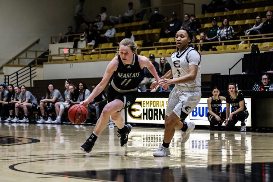 Action shot of Mallory McConkey vs Emporia State basketball