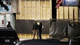 Police officers outside New Hampshire Hospital after a gunman opened fire and killed a security officer, Nov. 17, 2023.