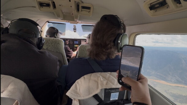 Four people in a plane.
