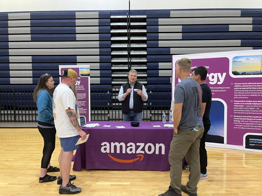 People hear about the energy usage of a data center proposed for Butler County at an Amazon open house Oct. 15.