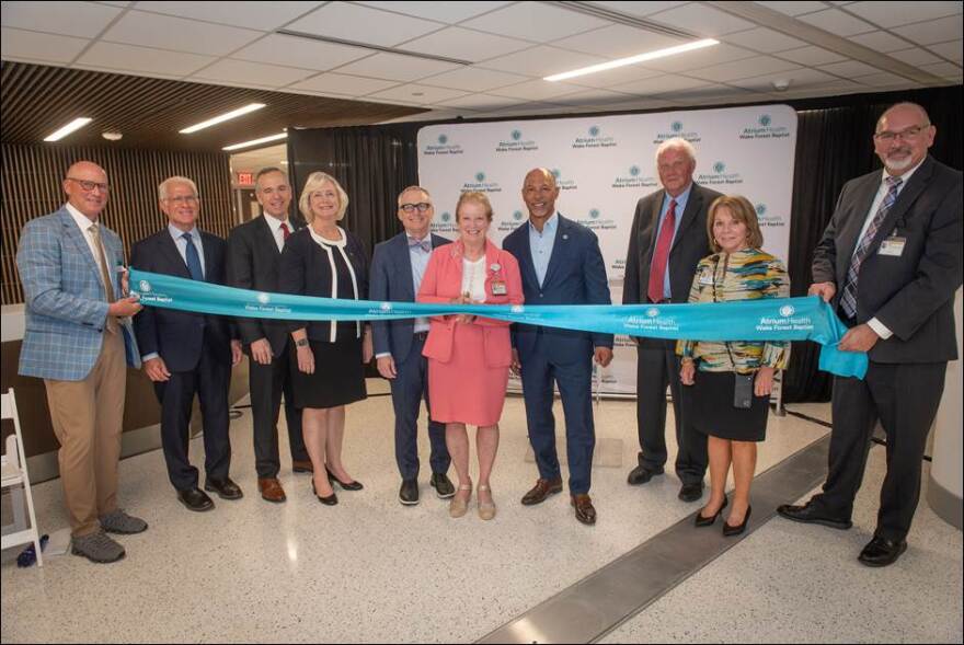 Health care leaders at the ribbon cutting for a new medical tower