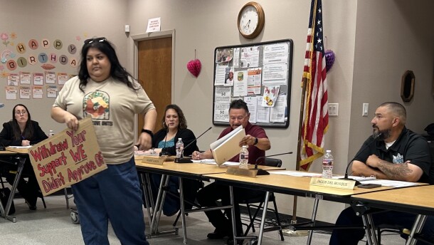 Estela Juarez presents a petition to the Orange Cove City Council during an April 22 meeting signed by 652 residents objecting to the city’s participation in a hydrogen blending project planned by the Southern California Gas Co.