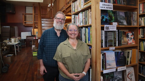 In this Sept. 1, 2026 photo, Wild Geese Books' new owners (from left) Bil and Julia Morrill are spending the days leading up to the stores opening cleaning and reorganizing the stock that came with the store when they bought it.