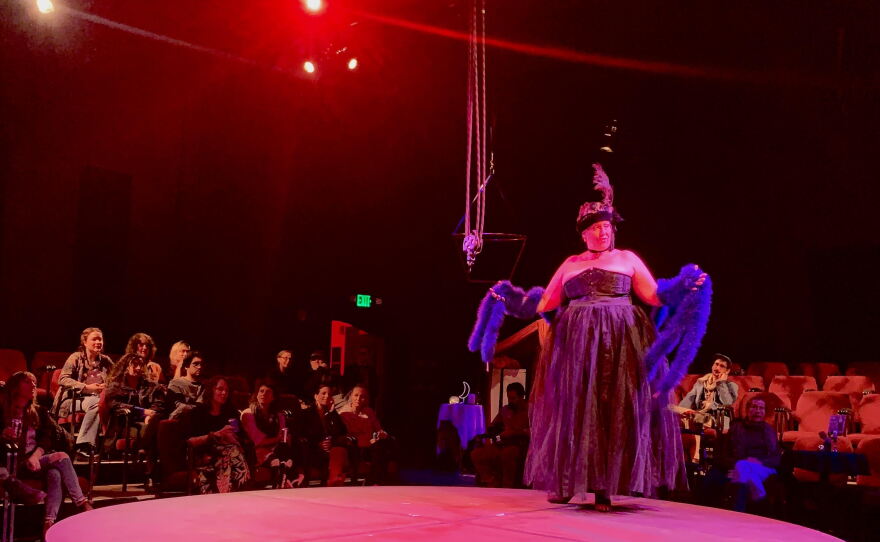 Lady Ambrosia (Nina Gabianelli) welcomes the audience to the House of Venus.