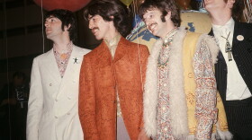 In this June 1967 file photo, Paul McCartney, from left, George Harrison, Ringo Starr and John Lennon of The Beatles appear backstage during a break in rehearsals for the live broadcast on the "Our World" program at EMI studios in London. 