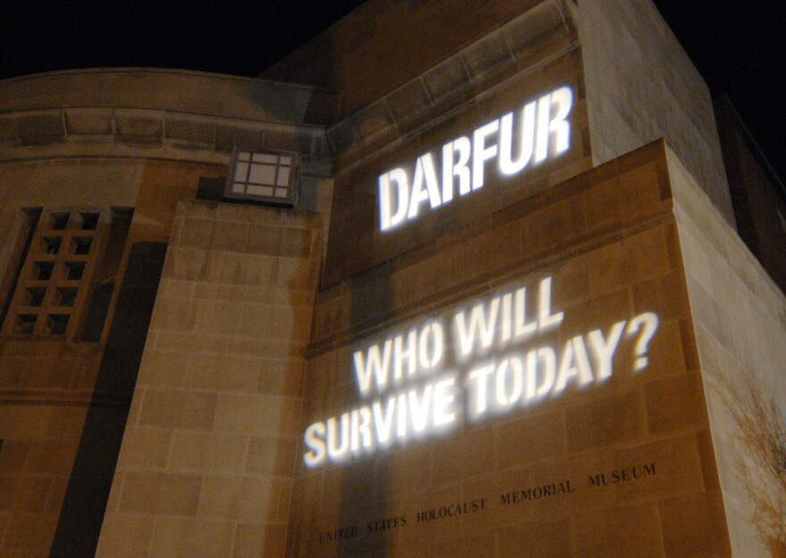 Words are projected on a front exterior wall of the Holocaust Memorial Museum, Monday, Nov. 20, 2006, in Washington, as part of an exhibit to bring attention to the ongoing genocide in Sudan. The museum declared the crisis in Dafur, Sudan, a genocide emergency in 2004.(AP Photo/Nick Wass)