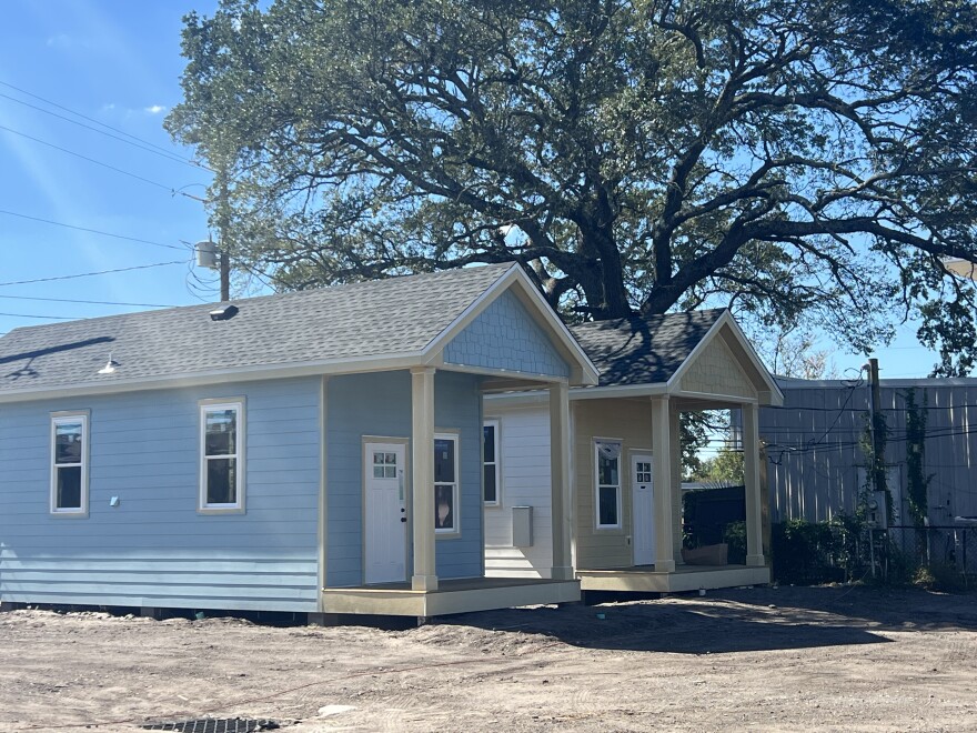 Trinity Village’s small cottages line the edge of Garden Street in Pensacola. The project aims to give vulnerable seniors a safe place to call home.