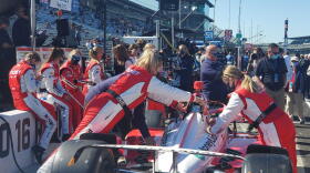 Paretta Autosport crew members prepare the car ahead of the 105th running of the Indianapolis 500.