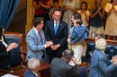 Justice Stephen Dent stands after the Utah Senate votes to confirm him, 25 to 4, to join the Utah Supreme Court, June 17, 2026. He stands by his wife and family as lawmakers applaud him.