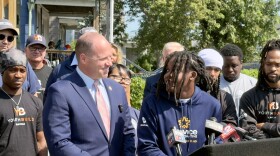 Congressman Tim Kennedy and The Service Collaborative YouthBuild participant Zaire Fayson smile at eachother during a press conference announcing millions of dollars in funding for youth workforce development programs in Buffalo on July 24, 2026.