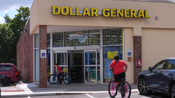 FILE - Children ride their bicycles to the Dollar General store, Aug. 21, 2025, in Nashua, N.H. (AP Photo/Charles Krupa, File)