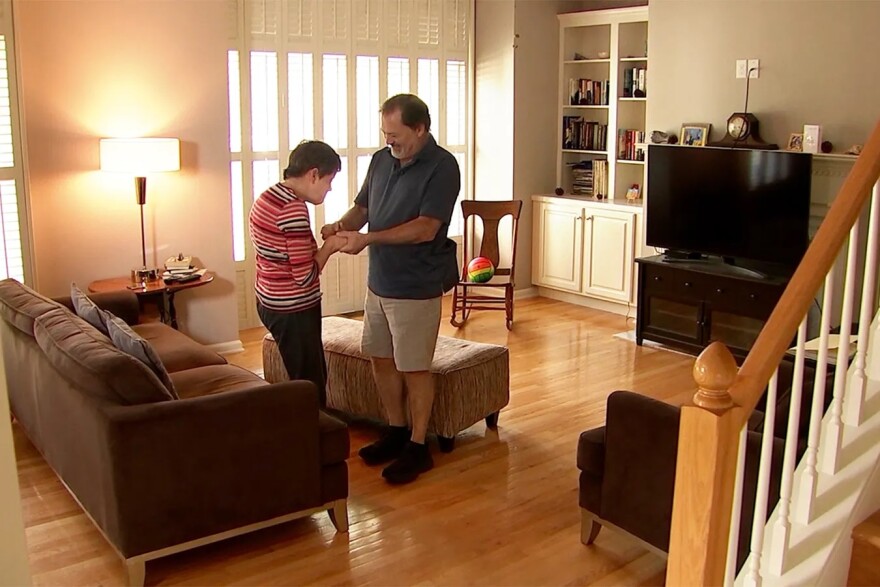 Julia Greune, who is blind and has cerebral palsy, with her father, Dave Greune. Dave received notice from the Social Security Administration that his daughter was overpaid “because her resources were more than a person could own and still get SSI.”