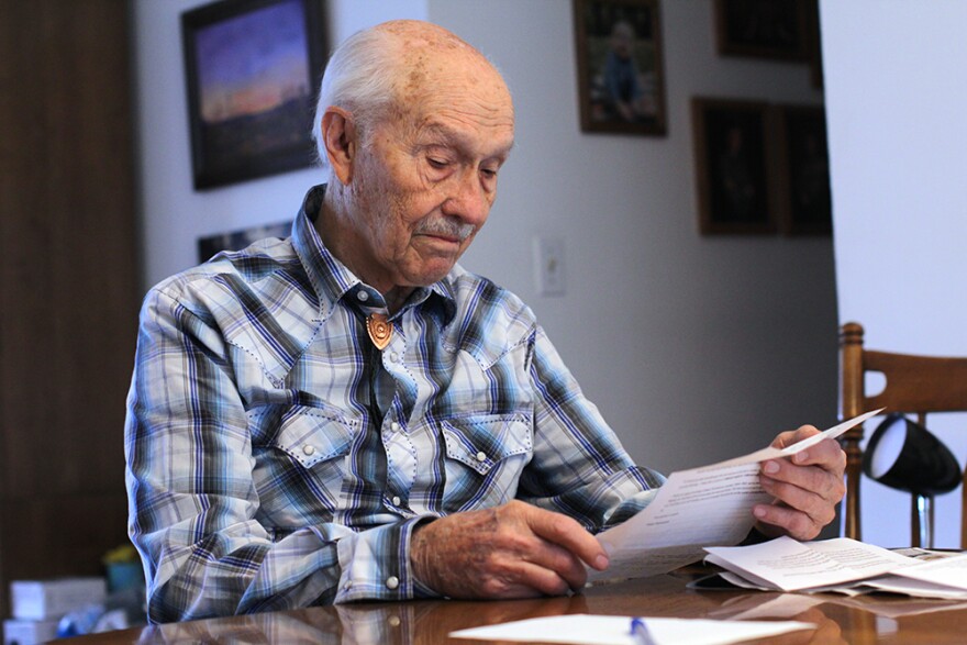 Lee Hadwiger, reads the letter he received from Kaiser Permanente in February informing him of the First Fill program. Hadwiger says he plans to switch back to his local pharmacy, Sid's, when the program is removed for Large Group base plansin Washington in 2024. (Credit: Rachel Sun / The Lewiston Tribune and NWPB)