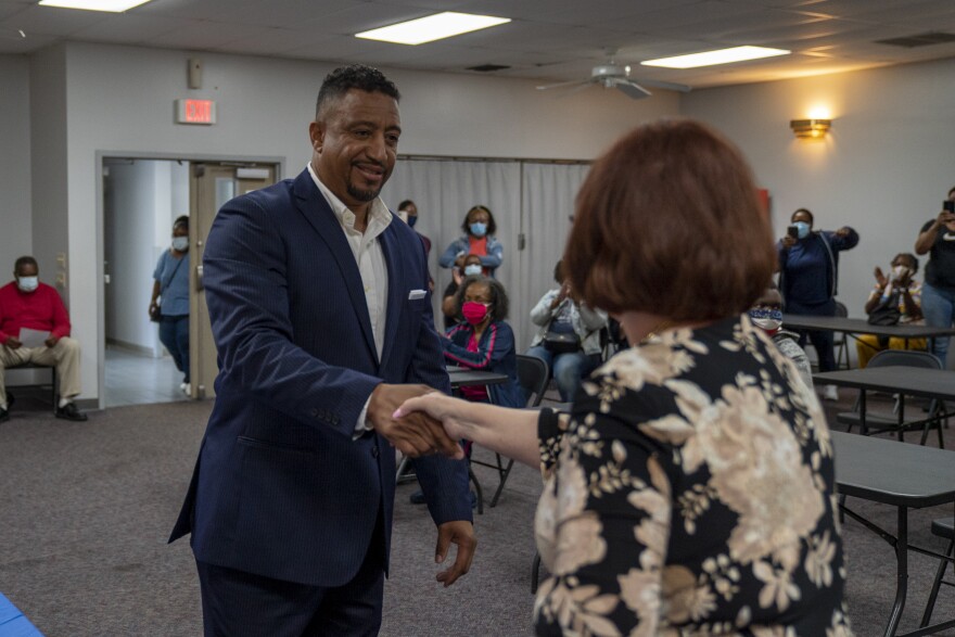  Mark Crochrell Sr. shakes Madison County Clerk Debbie Ming Mendoza's hand after being sworn into the Venice Township Supervisor role. Crochrell is the first Black township supervisor in Venice and Madison County.