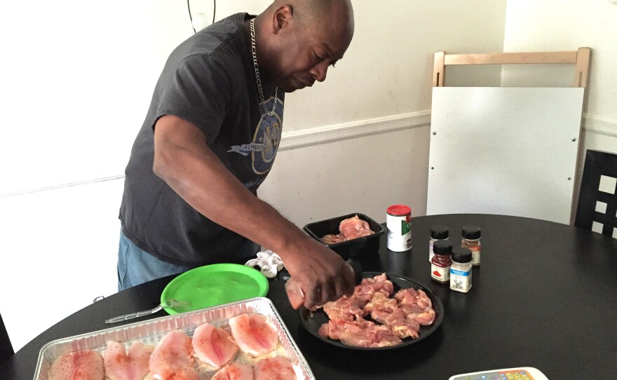 Felipa prepares dinner for his family at their home in West Baltimore, Md.