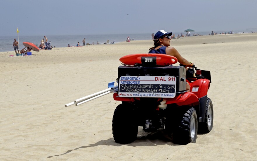 A lifeguard patrols the beach in N.C. (AP Photo/Gerry Broome)