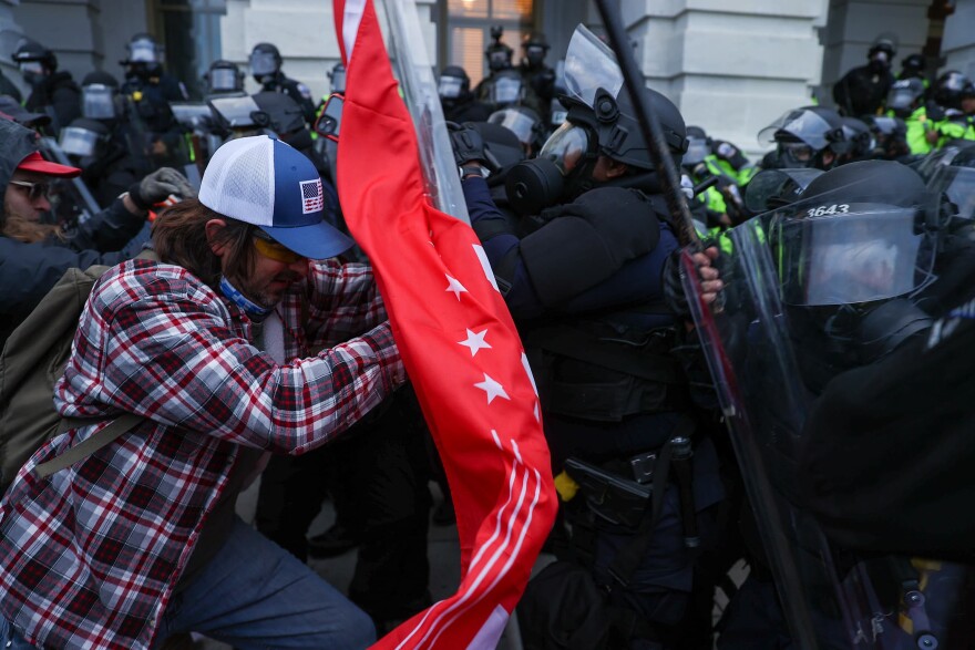 Security forces clash with President Trump's extremist supporters after they breached the U.S. Capitol security in Washington, D.C. on Jan. 6. (Tayfun Coskun/Anadolu Agency via Getty Images)