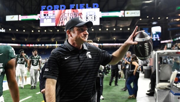 Michigan State head coach Jonathan Smith acknowledges fans as he leaves the field at the end of an NCAA college football game against Maryland, Saturday, Nov. 29, 2025, in Detroit.
