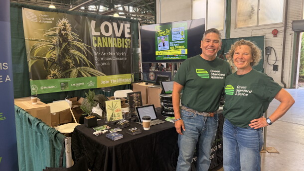 Herb Barbot, left, and Linda Baldwin stand at the Green Standard Alliance booth at the New York State Fair.
