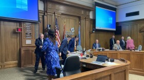  Re-elected Springfield Mayor Ken McClure shakes hands with new and re-elected members of City Council after their swearing-in on April 17, 2023.