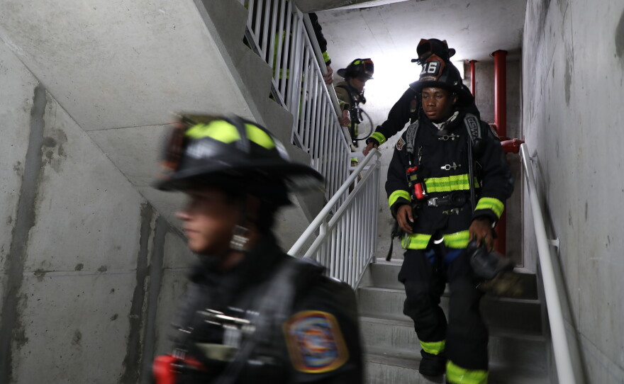 Firefighters participate in the 9-11 stair climb on Navarre Beach.