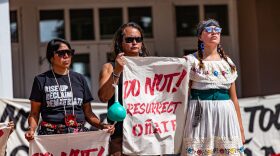 Organizers and supporters on Sept. 28, 2023, celebrate Rio Arriba County’s postponement of putting back a statue of the war criminal and Spanish colonizer Juan de Oñate that officials removed in 2020. Jacob Johns (Hopi, Akimel O'odham). the environmental activist who was later shot, stands in the middle. 