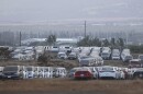 FILE — Unused rental cars fill a dusty field near Kahului Airport, Friday, Sept. 1, 2023, on Maui.