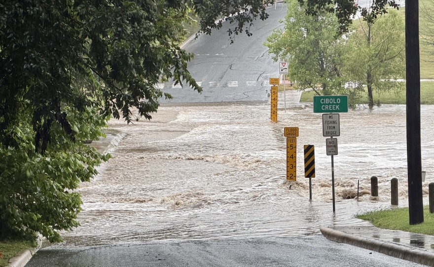 Cibolo Creek overruns Theissen Road, downtown Boerne