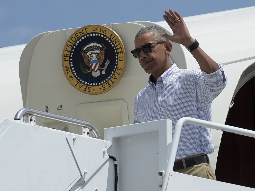 President Obama steps off Air Force One as he arrives at Baton Rouge Metropolitan Airport in Baton Rouge, La., on Tuesday.