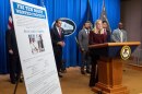 Attorney General Pam Bondi stands near wanted poster for Canadian fugitive Ryan James Wedding as she speaks with reporters during a news conference at the Department of Justice, Wednesday, Nov. 19, 2025, in Washington.