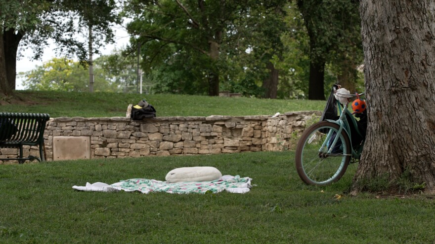 A pillow and blanket lie on the ground in Seminary Park. Starting Wednesday, police might have to investigate circumstances like these for violations of Senate Enrolled Act 285.