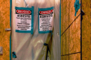 A photo from a 2017 LDEQ report showing an unsecured asbestos containment area at Lafayette Academy Charter School.