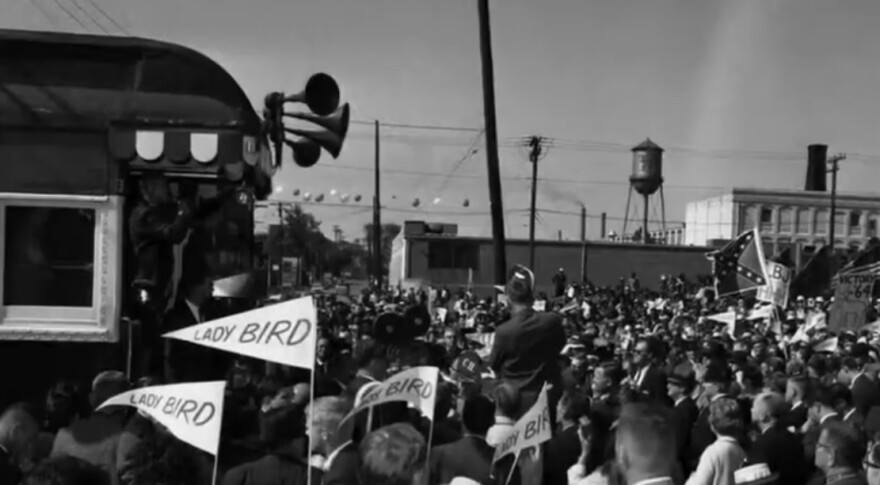 Crowds of supporters and opponents turn out at the stops of the Lady Bird Special