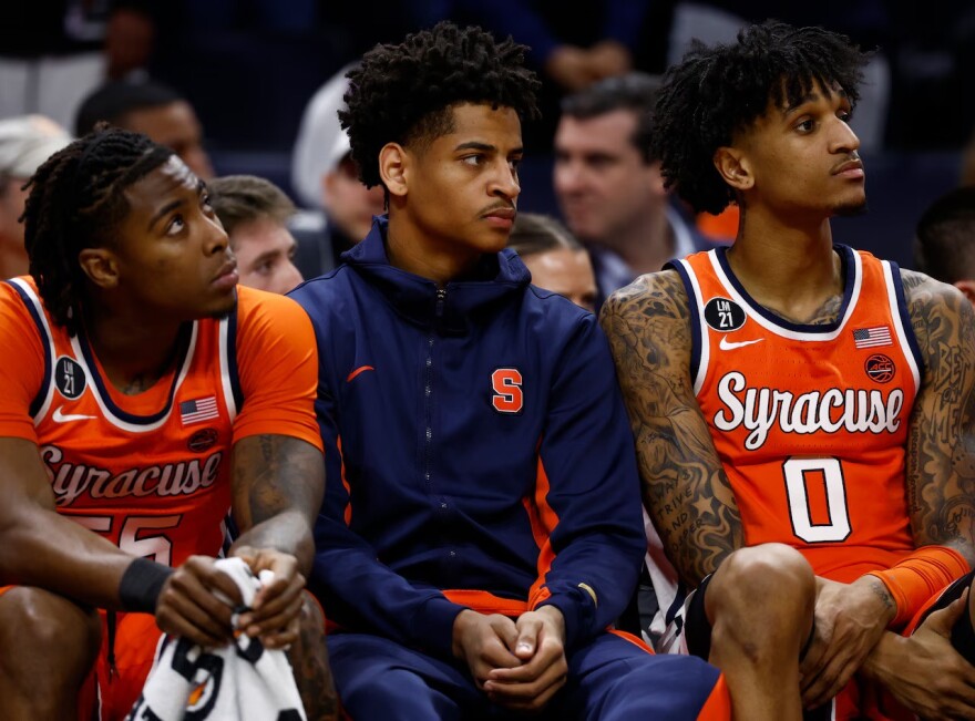 Kiyan Anthony (7, White) sitting on bench watching SU battle Virginia Saturday.
