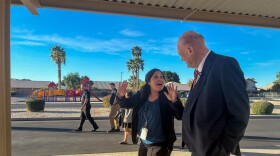 Principal Analisa Angulo animatedly shares the keys to Desert View Academy's success with Horne.
