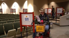An Anchorage voter looks over the city election ballot on Tuesday, April 7, 2026 at the Loussac Library.