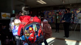Students arrive for the first day of in-person learning for five days per week at Stark Elementary School on March 10, 2021 in Stamford, Connecticut.