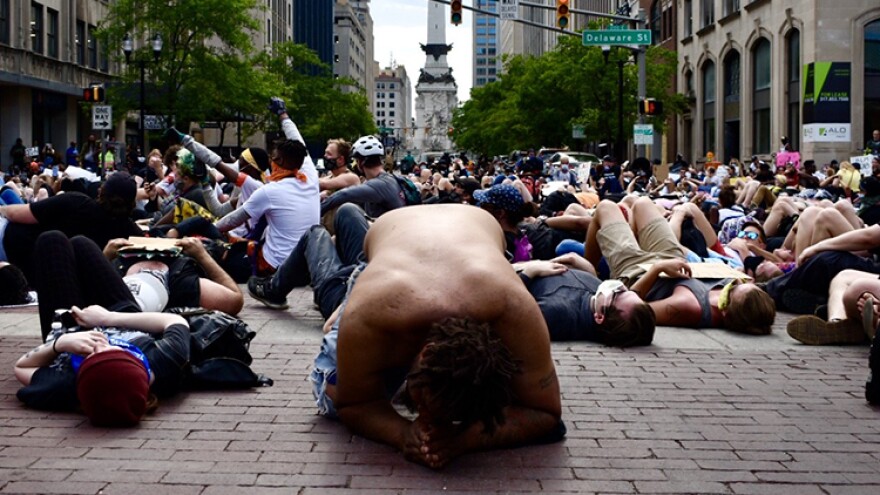 Protestors, calling for an end to police brutality and racial injustice, stage a die-in outside the City-County Building in downtown Indianapolis.