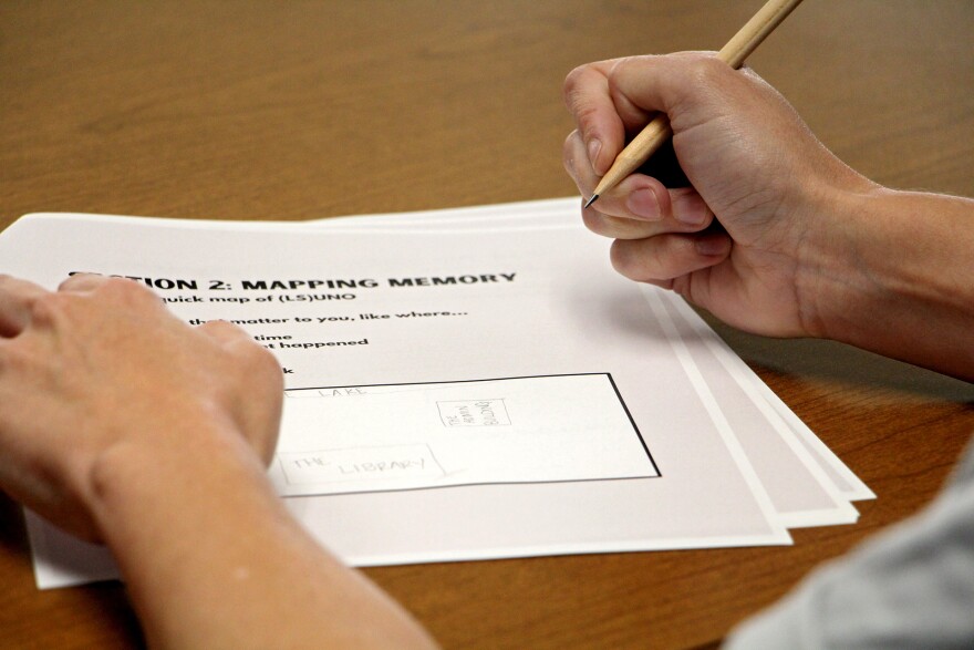 A participant works through the "Mapping Memory" section of the community workshop workbook at the Midlo Center in the Earl K. Long Library at the University of New Orleans on Thursday, June 25, 2026.