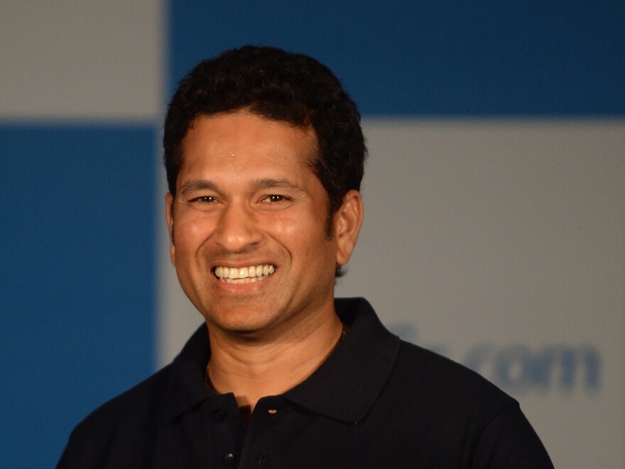 Sachin Tendulkar smiles during a news conference in Mumbai on Oct. 23. The beloved batsman was one of cricket's first millionaires.