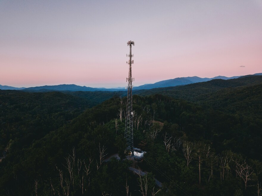 Pink skies behind cell tower