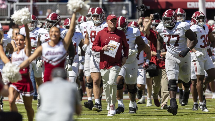 Alabama head coach Kalen DeBoer leads his team onto the field before Alabama's A-Day NCAA college football scrimmage, Saturday, April 13, 2024, in Tuscaloosa, Ala.