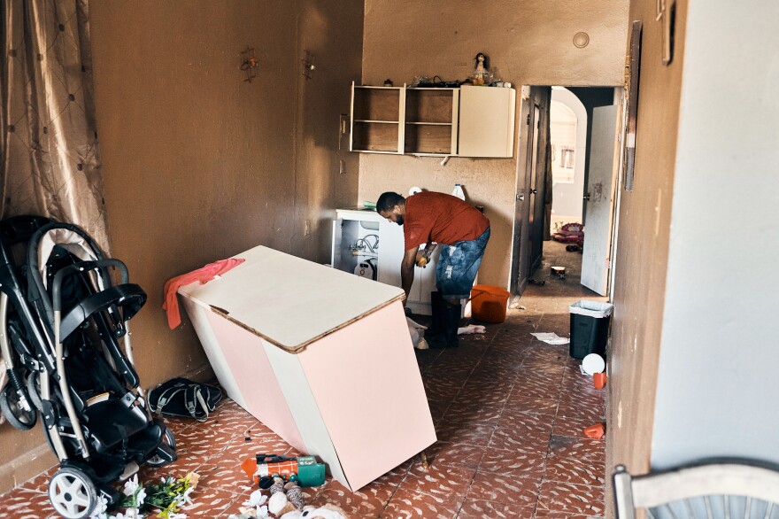 Luis Martínez Torres and his family of six evacuated their home in Guanica on Tuesday. The foundation showed signs of cracking and all of their belongings were violently thrown around the house.