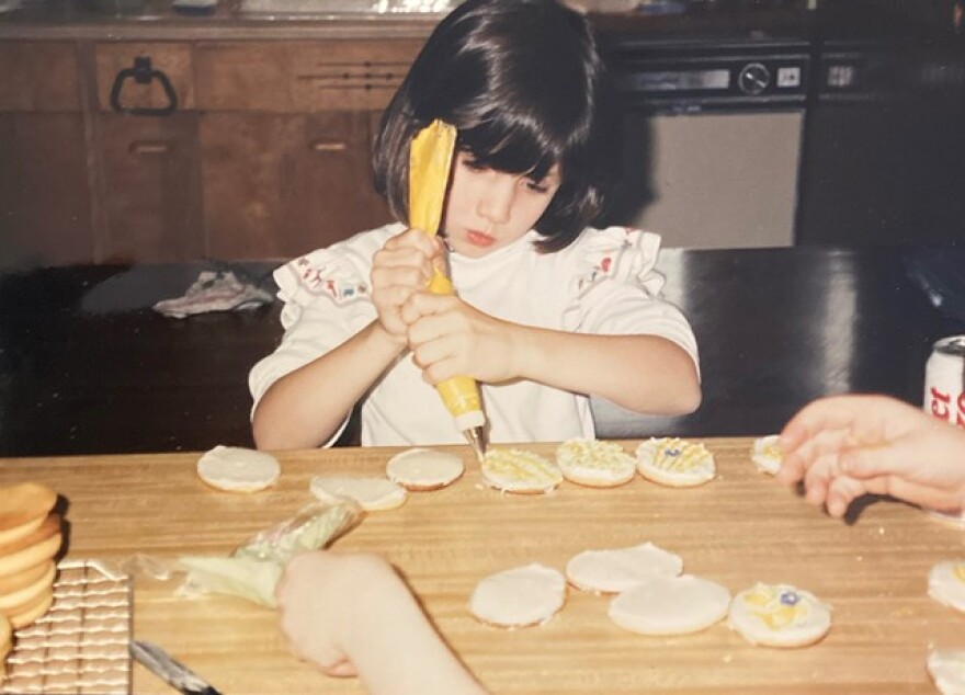 Petit Poutinerie Chef Lizzie Clapp at the baking table as a young girl.