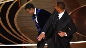 Will Smith slaps Chris Rock onstage during the 94th Oscars at the Dolby Theatre in Hollywood, California on March 27, 2022. (Robyn Beck/AFP via Getty Images)