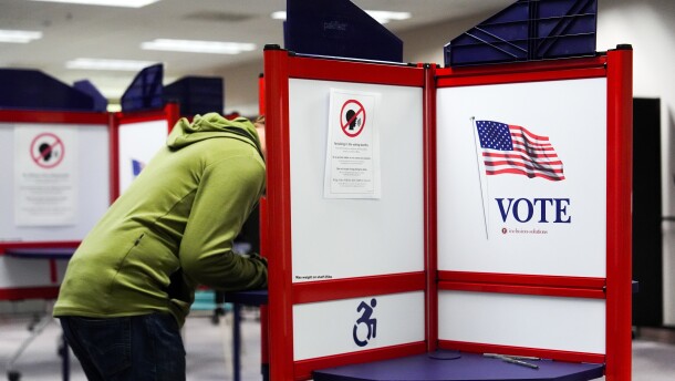 FILE - A person votes early in the Virginia redistricting referendum at the Fairfax County Government Center, April 3, 2026, in Fairfax, Va.