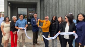 Jesse Noriega, executive director of the Greater Quad Cities Hispanic Chamber of Commerce, cut the ribbon on their new larger office location in downtown Silvis, May 22, 2026.