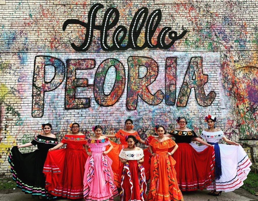 Peoria Folklore Ballet dancers pose for a photograph.