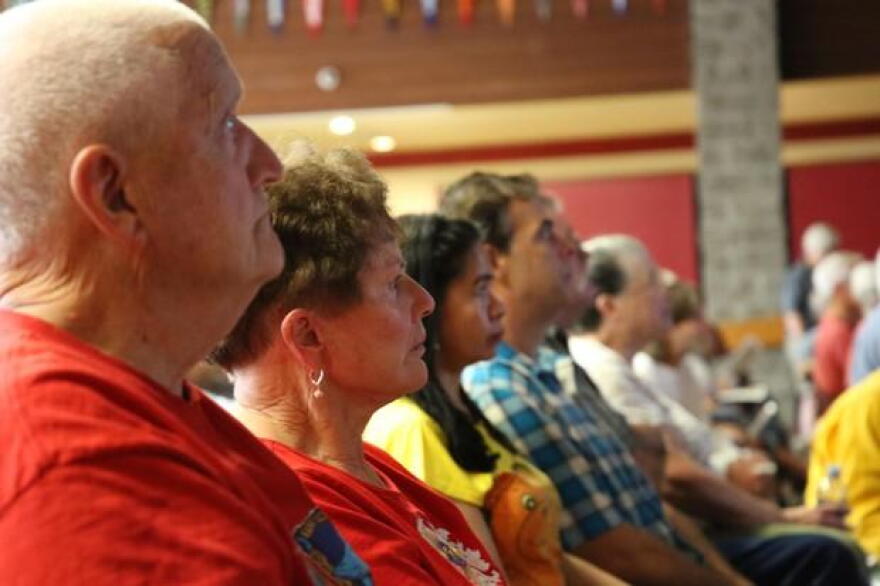 About 400 people turned out to a community meeting with fire managers in Merlin, Oregon, as the Taylor Creek Fire threatened hundreds of homes in July 2018.